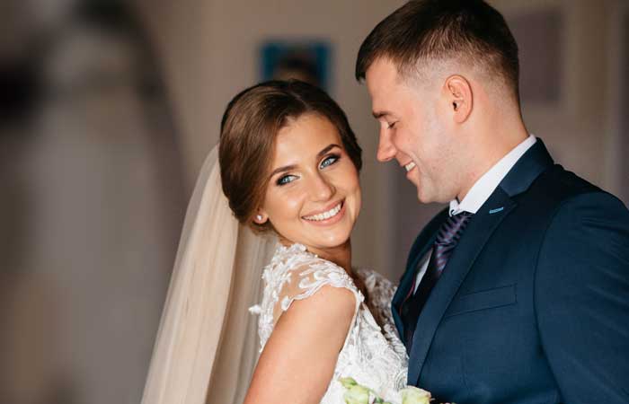 Bride smiling with groom